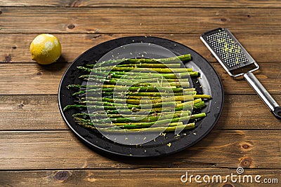 Lemon zest asparagus on plate ready to eat Stock Photo