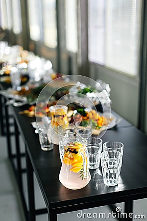 Lemonade and glasses on a black table. Festival. Stylish kitchenware Stock Photo