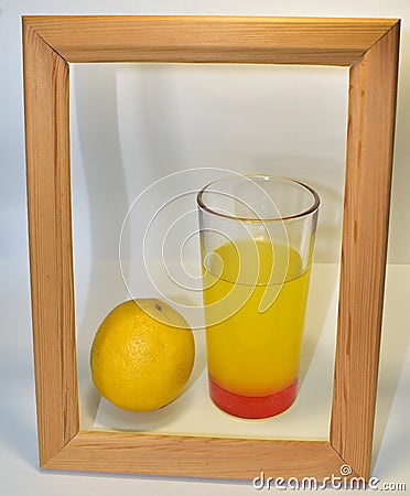 Lemonade and lemon in a wooden frame Stock Photo