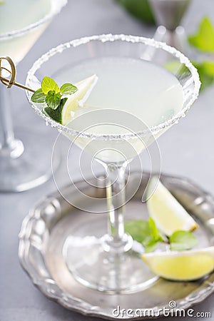 Lemonade martini cocktail garnished with lime Stock Photo