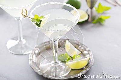 Lemonade martini cocktail garnished with lime Stock Photo