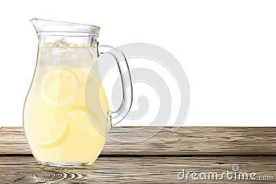 Lemonade pitcher on wooden table Stock Photo