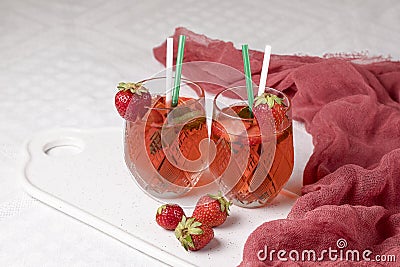 Lemonade with strawberry glass on a white background. Stock Photo