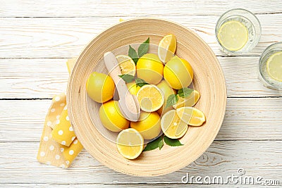 Lemonades and bowl with lemons on background, top view Stock Photo