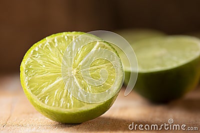 Lemons cut in half. Wood background Stock Photo