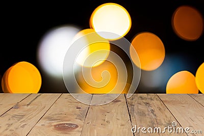 Lens blur glitter bright light and rustic wood table Stock Photo