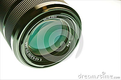 Lens for a photo camera. Zoom in on something in the distance, bring it closer and be able to take a better photo. Stock Photo