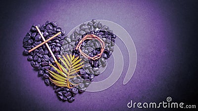 Lent Season,Holy Week and Good Friday concepts - image of wooden cross, crown of thorns and palm leave on stones in purple vintage Stock Photo