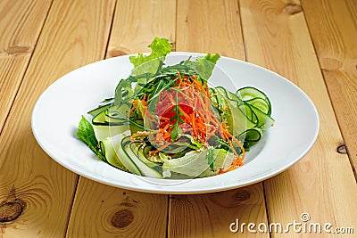 Lenten salad with cucumber, spicy carrot, arugula and sesame Stock Photo