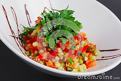 Lenten salad with tomato, marrow squash, cuscus, zucchini and paprika Stock Photo