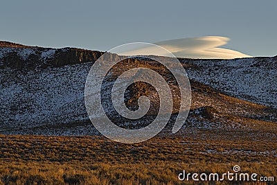 Lenticular clouds form over the Sierra Nevada Stock Photo