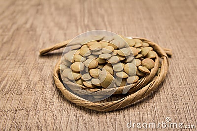 Lentil legume. Paper rope around grain. Selective focus. Stock Photo