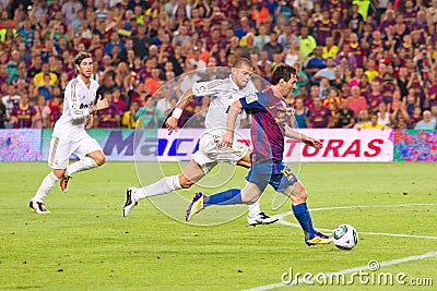 Leo Messi and Pepe in action Editorial Stock Photo