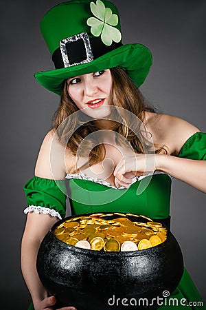 Leprechaun gold hiding between her breasts Stock Photo