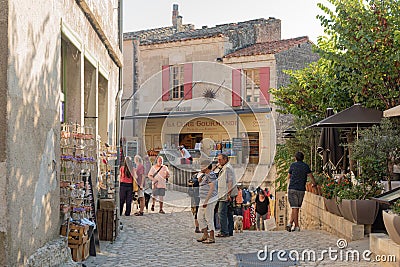 LES BAUX DE PROVENCE, SEPTEMBER 20, FRANCE 2018: View of tourist walking in the historical center of Les Baux de Provence Editorial Stock Photo