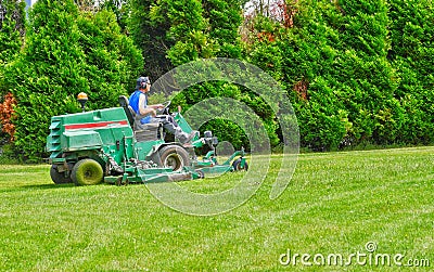Les Mureaux, France - june 24 2016 : man on a ride on mower Editorial Stock Photo