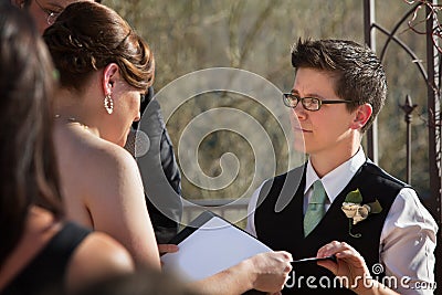 Partners Reading Marriage Vows Stock Photo