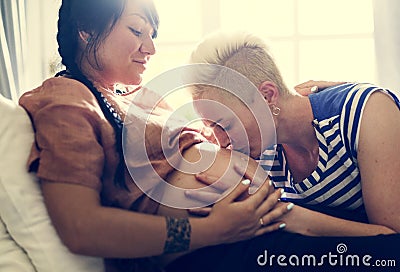 A lesbian woman kissing the belly Stock Photo