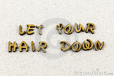 Let hair down relax fun enjoy enjoyment letterpress type Stock Photo