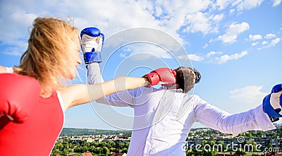 Let her win concept. Couple boxing gloves fight sky background. Leadership family relations. Things guy can do to make Stock Photo