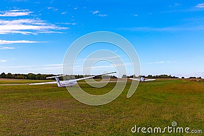 LET L-23 Super Blanik glider aircraft being towed into the air by a tow plane. Editorial Stock Photo