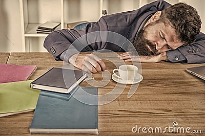 let me relax. Man sleeping over workplace. coffee will help me. bored and exhausted guy sleep at work. need break for Stock Photo