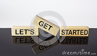 Let`s get started text on wood block and black and white background. business concept Stock Photo