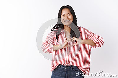 Let there be love. Portrait of charming upbeat and confident young asian woman confessing in sympathy and feelings Stock Photo