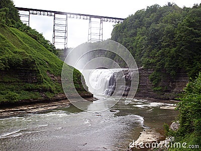 Old rail bridge on top of the water falls at Letchworth State Park, Upstate NY, USA Stock Photo