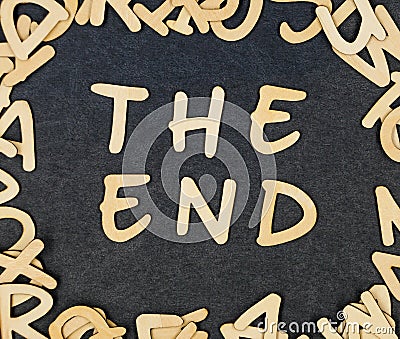 Letter `The end` composed of wooden letters. Stock Photo