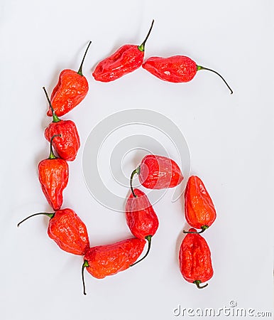 Letter G alphabet made with Ghost pepper Bhoot jolokia over white background Stock Photo