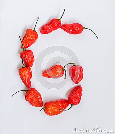 Letter G alphabet made with Ghost pepper Bhoot jolokia over white background Stock Photo