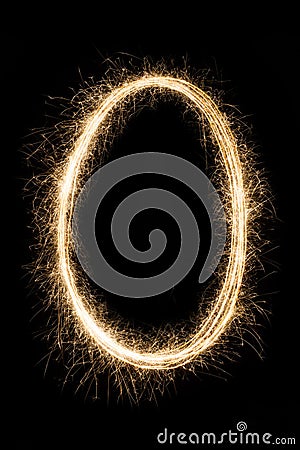 Letter or number null O from sparklers alphabet on black Stock Photo