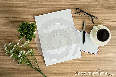 Letter paper with coffee on wood background. Stock Photo