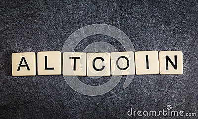 Letter tiles on black slate background spelling Altcoin Stock Photo