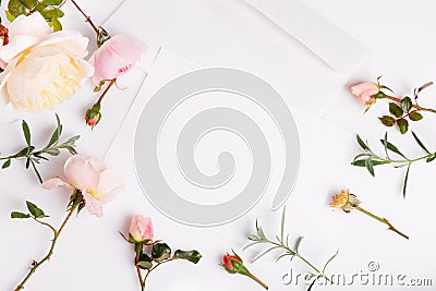 Letter, white envelope on white background with pink english rose. Invitation cards or love letter. Stock Photo