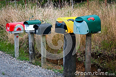 Letterboxes on a rural country road Stock Photo