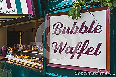 Lettering bubble waffel at a waffle stand at a festival Editorial Stock Photo