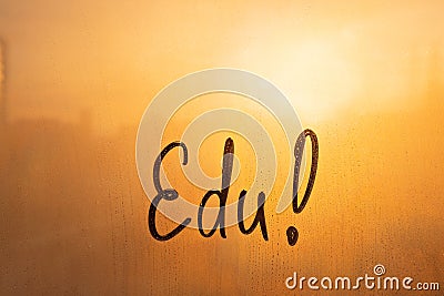 Lettering Estonian language text Edu is Good luck in english message written finger on foggy glass wet sunset window Stock Photo