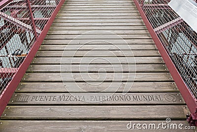 Lettering unesco puente vizcaya-patrimonio mundial on the suspension bridge of bizkaia puente de vizcaya between getxo and Stock Photo