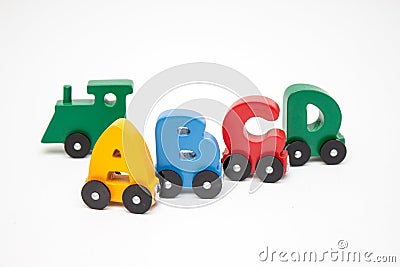 Letters A, B, C, D of a train alphabet with locomotive. Bright colors of red yellow green and blue on a white background. Early ch Stock Photo