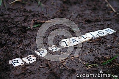 Reputation trampled in the mud. Stock Photo