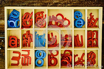 Letters to learn to write and read in your wooden box, montessori classroom Stock Photo