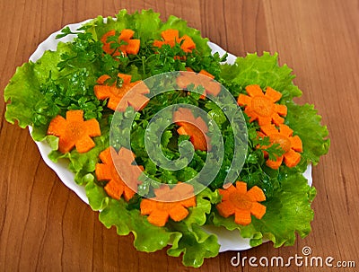 Lettuce and carrot cutting. Stock Photo