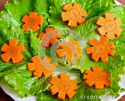Lettuce and carrot cutting. Stock Photo