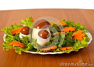 Lettuce and carrot cutting with mushroom. Stock Photo