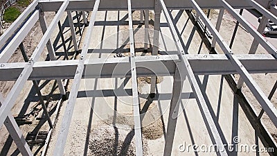 Leveling And Compaction Of Soil On The Construction Site. Modern Mini excavator Leveling The Ground With The Front Stock Photo