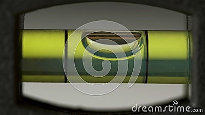 Leveling instrument`s bubble closeup. Carpenter`s spirit level macro. Buildings and construction level Stock Photo