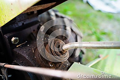 Lever connecting the cutter drive on a walk-behind tractor close-up. Tractor implement control element Stock Photo