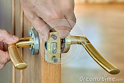 Lever door handle is installed in interior door of house. Stock Photo